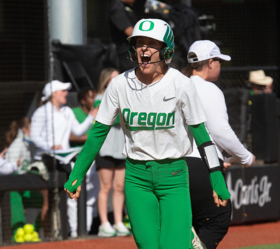 Oregon’s Kai Luschar celebrates as she runs for home off a Ariel Carlson home run hit during their game against Oregon State at Jane Sanders Stadium Sunday, April 21, 2024.