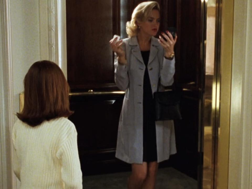 Annie waiting for the elevator in the hotel when Meredith shows up in "The Parent Trap."