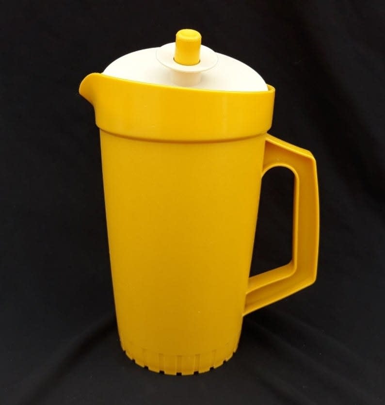 A yellow plastic pitcher