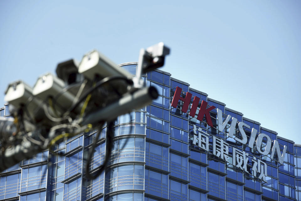 In this Wednesday, May 22, 2019, photo, surveillance cameras are seen outside the headquarters of Chinese security technology company Hikvision in Hangzhou in eastern China's Zhejiang province. Stepping up a propaganda offensive against Washington, China's state media on Friday accused the U.S. of seeking to "colonize global business" by targeting telecom equipment giant Huawei and other Chinese companies. (Chinatopix via AP)