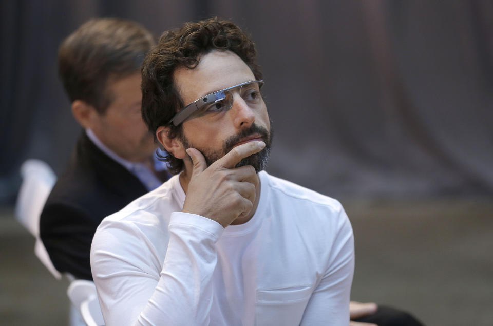 Google co-rounder Sergey Brin wears Google Glass glasses at an announcement for the Breakthrough Prize in Life Sciences at Genentech Hall on UCSF’s Mission Bay campus in San Francisco, Wednesday, Feb. 20, 2013. Google is giving more people a chance to pay $1,500 for a pair of the Internet-connected glasses that the company is touting as the next breakthrough in mobile computing. The product, dubbed "Google Glass," will be offered to "bold, creative individuals" selected as part of a contest announced Wednesday. Participants must live in the U.S. and submit an application of up to 50 words explaining what they would do with the Google Glass technology. (AP Photo/Jeff Chiu)