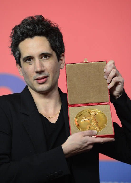 French director Jean-Bernhard Marlin poses with the Golden Bear award for best film of the international short film jury for "La Fugue" ("The Runaway") at a press conference after the awards ceremony of the 63rd Berlinale Film Festival, in Berlin on February 16, 2013