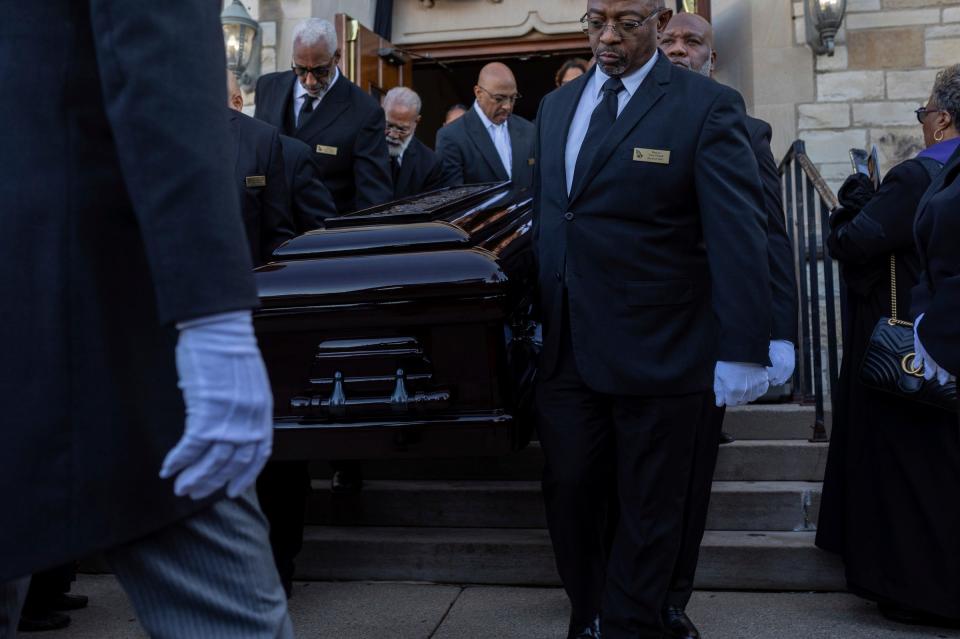 Deacon Cary Powell, center, helps carry the casket of the Rev. Charles G. Adams, a retired pastor, during his funeral ceremony at the Hartford Memorial Baptist Church in Detroit on Friday, Dec. 15, 2023.