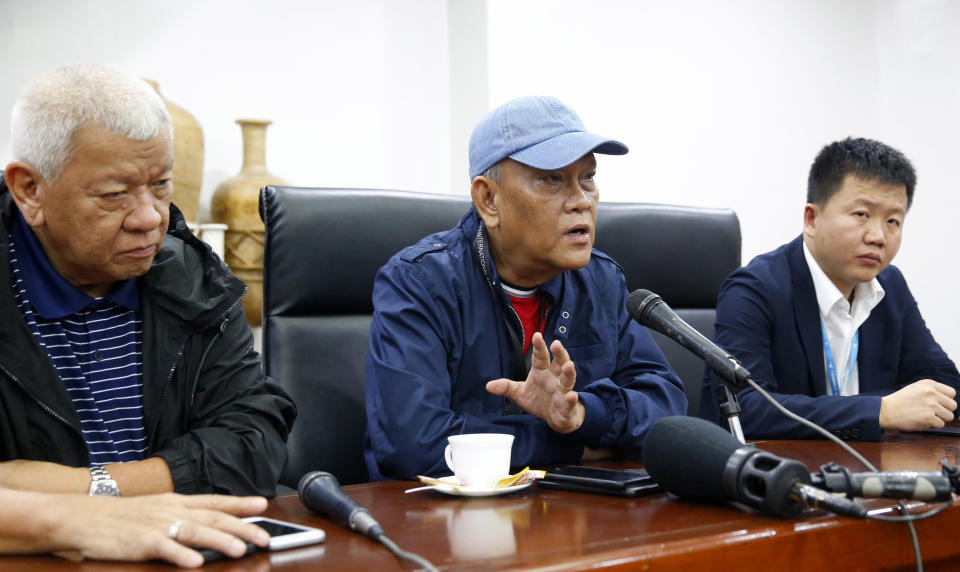 Ninoy Aquino International Airport general manager Ed Monreal, center, gestures during a news conference explaining the details after a Chinese Xiamen Air Boeing passenger plane skidded off the runway while landing Friday, Aug. 17, 2018, in Manila, Philippines. The Xiamen Air flight MF8667 has skidded off a runway at Manila's airport while landing in a downpour and its 157 passengers and eight crew members have been evacuated by emergency slide. At left is Civil Aviation Authority of the Philippines Director General Jim Sydiongco and at right is Xiamen Air General Manager Lin Huagun. (AP Photo/Bullit Marquez)