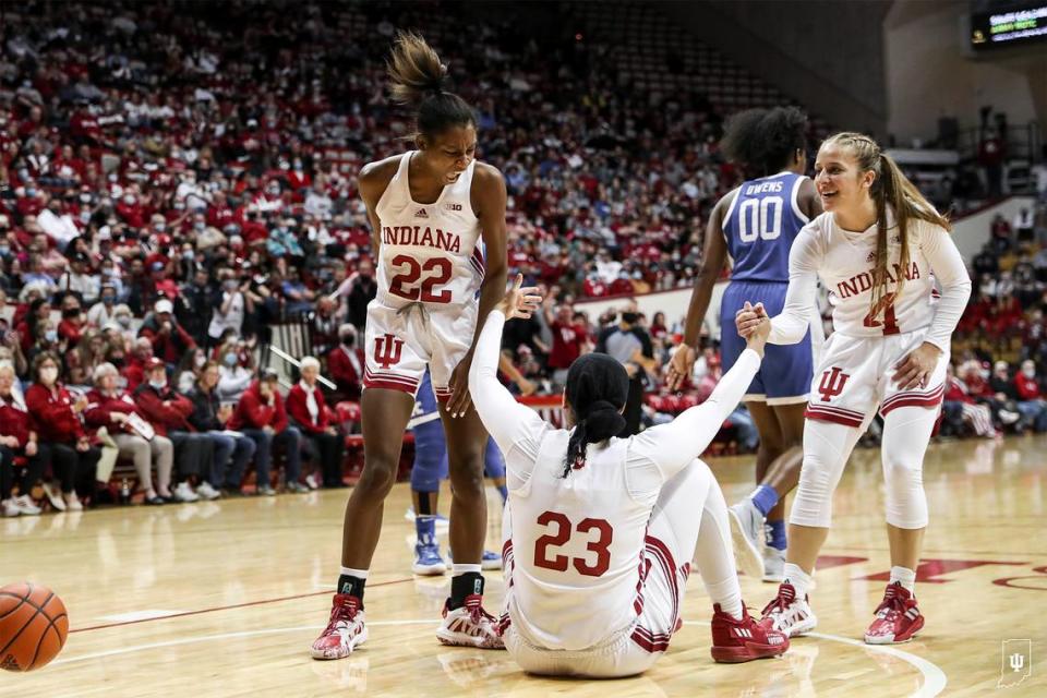 Indiana’s Chloe Moore-McNeil (22) and Nicole Cardano-Hillary (4) helped up teammate Kiandra Browne after Browne absorbed a charging four from Kentucky’s Olivia Owens (00). Owens was one of four Kentucky players to finish the game with four fouls.