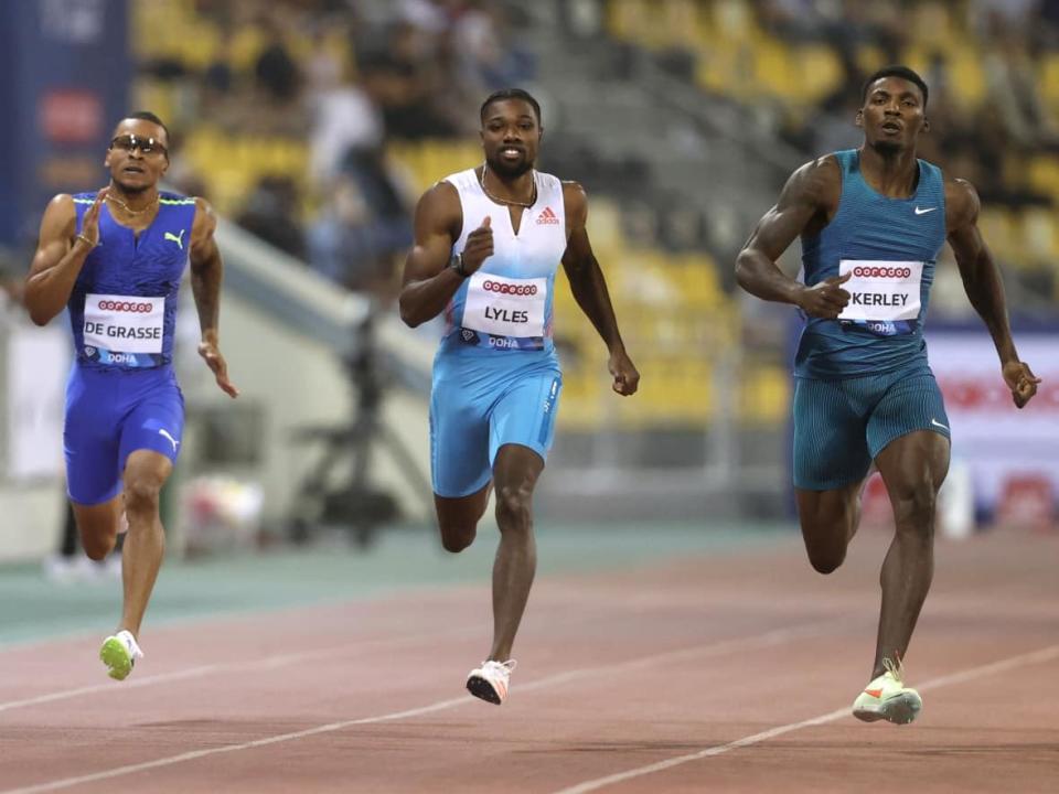 Canada's Andre De Grasse, left, seen during a previous Diamond League race on May 13, finished last in the men's 100-metre event at the Prefontaine Classic on Saturday in Eugene, Ore., with a time of 10.21 seconds. (Ibraheem Al Omari/Reuters - image credit)