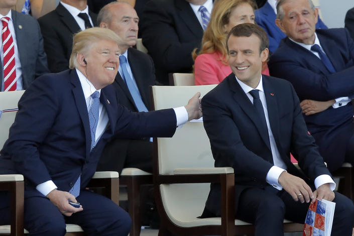 President Trump with French President Emmanuel Macron during the Bastille Day military parade in Paris, July 14, 2017. (AP Photo/Michel Euler, File)