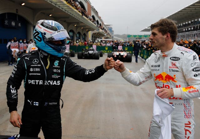 Valtteri Bottas, left, won while Max Verstappen took the title lead by finishing second