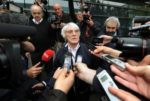 Formula One supremo Bernie Ecclestone (C) speaks to the media after meeting with Formula One team officials to discuss the Bahrain F1 race at the Shanghai International Circuit. The Bahrain Grand Prix will go ahead next week as planned, Formula One bosses have declared, despite fears it could be targeted by violent anti-government demonstrations