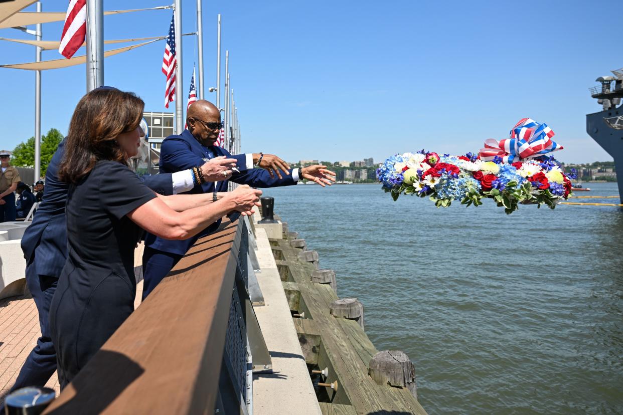 New York Governor Kathy Hochul and New York City Eric Adams throw a wreath into the Hudson River during the Intrepid Sea, Air & Space Museum’s annual Memorial Day Commemoration Ceremony on May 31, 2022 in New York City. 