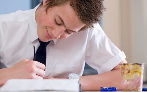 Boy drawing on table - David Leahy