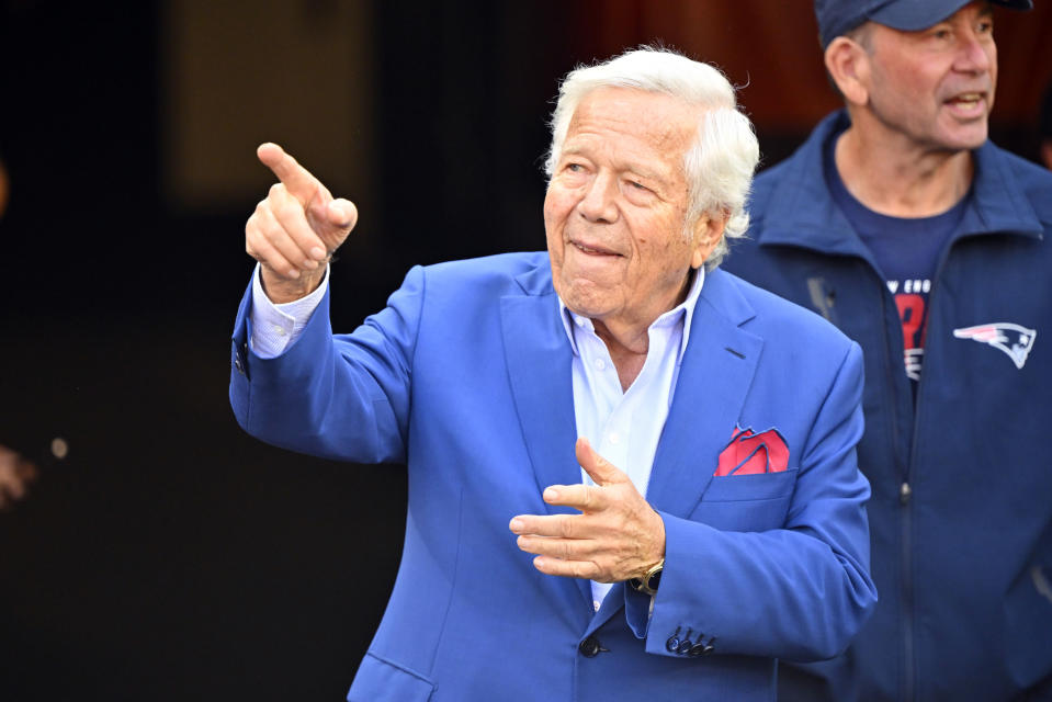 New England Patriots owner Robert Kraft gestures to people as he walks on the field during the second half an NFL football game against the Cleveland Browns, Sunday, Oct. 16, 2022, in Cleveland. (AP Photo/David Richard)