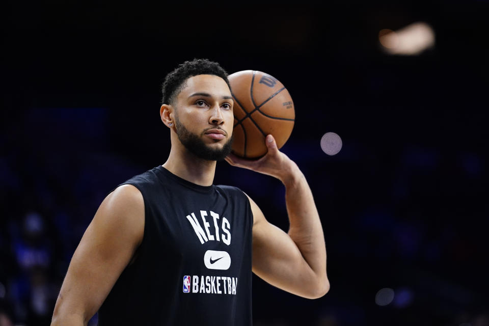 FILE - Brooklyn Nets' Ben Simmons watches practice before an NBA basketball game, Thursday, March 10, 2022, in Philadelphia. Simmons and the Philadelphia 76ers have settled the grievance he filed to recoup a portion of last season's salary, a person with knowledge of the details said Monday, Aug. 15, 2022. (AP Photo/Matt Slocum, File)