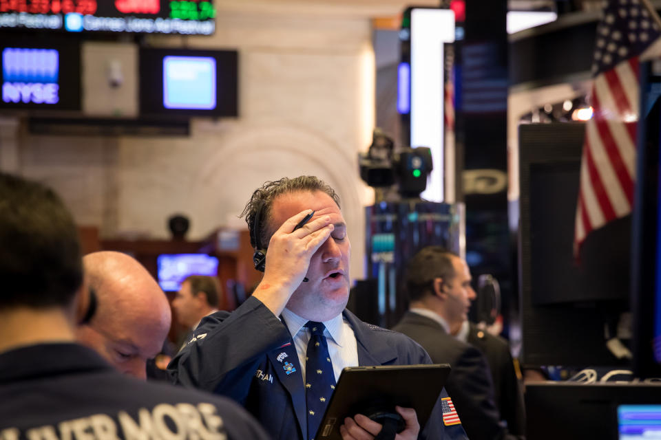 NEW YORK, March 18, 2020 -- Traders work at the New York Stock Exchange in New York, the United States, on March 18, 2020. The S&P 500 tumbled 7 percent at around 1 p.m. Eastern Time, triggering a key circuit breaker that halted trading for 15 minutes. It was the second time this week that the circuit breaker has been tipped. (Photo by Michael Nagle/Xinhua via Getty) (Xinhua/ via Getty Images)