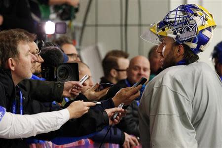 Sweden's goalie Henrik Lundqvist talks to reporters after a men's ice hockey team practice at the 2014 Sochi Winter Olympics February 20, 2014. REUTERS/Brian Snyder