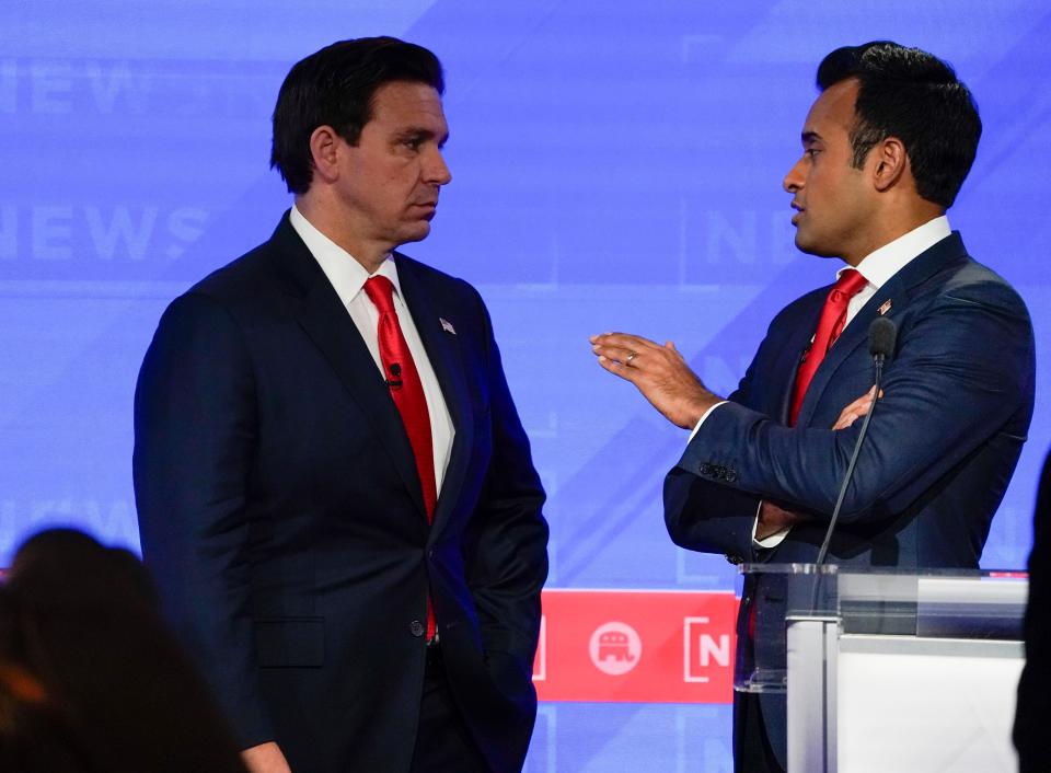 Florida Gov. Ron DeSantis and businessperson Vivek Ramaswamy during a break in the fourth Republican Presidential Primary Debate.