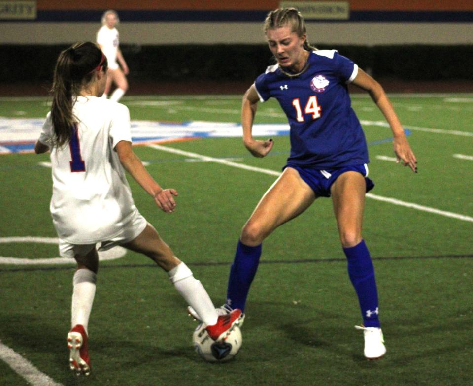 Wolfson forward Zoey Cooler (1) and Bolles midfielder Annalise Cannada (14) challenge for possession during a District 3-3A high school girls soccer final on February 3, 2022. [Clayton Freeman/Florida Times-Union]