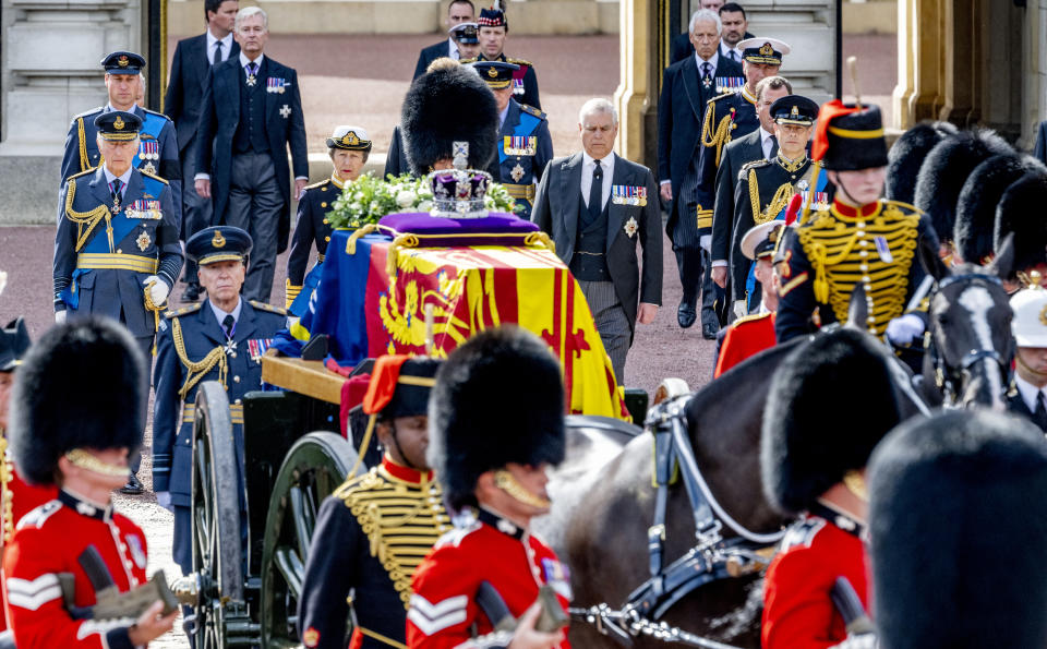 LONDON, ENGLAND - SEPTEMBER 14: (L-R) King Charles III, Prince William Prince of Wales, Princess Anne The Princess Royal, Prince Andrew Duke of York and Prince Edward Earl of Wessex walk behind the Queen Elizabeth II's coffin during the procession from Buckingham Palace to the Palace of Westminster on September 14, 2022 in London, United Kingdom. Queen Elizabeth II's coffin is taken in procession on a Gun Carriage of The King's Troop Royal Horse Artillery from Buckingham Palace to Westminster Hall where she will lay in state until the early morning of her funeral. Queen Elizabeth II died at Balmoral Castle in Scotland on September 8, 2022, and is succeeded by her eldest son, King Charles III. (Photo by Patrick van Katwijk/Getty Images)