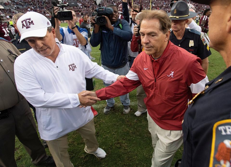 Texas A&M coach Jimbo Fisher, left, and Alabama's Nick Saban shake hands at midfield after their 2019 game in College Station, which Alabama won. But the Aggies upset the Crimson Tide in last year's game at A&M.