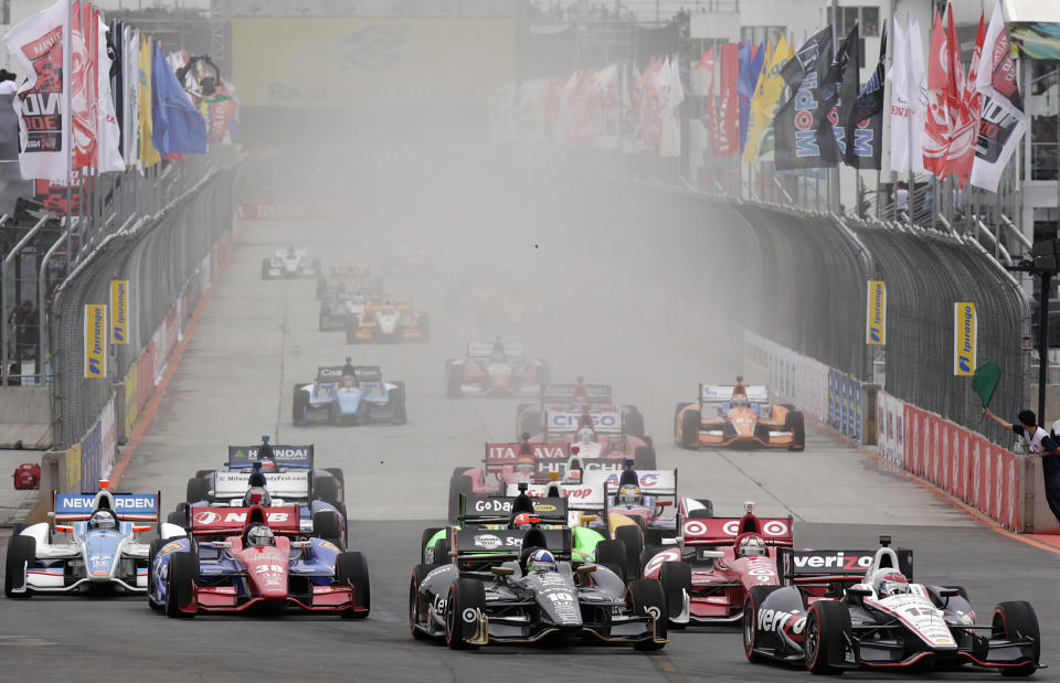 IndyCar driver Will Power, of Australia, right, leads the pack during the start of the IndyCar Sao Paulo 300 in Sao Paulo, Brazil, Sunday, April 29, 2012. (AP Photo/Andre Penner)