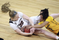 Oregon State forward Ellie Mack (20) and California guard Leilani McIntosh (1) reach for a loose ball during an NCAA college basketball game in the first round of the Pac-12 women's tournament Wednesday, March 3, 2021, in Las Vegas. (AP Photo/Isaac Brekken)