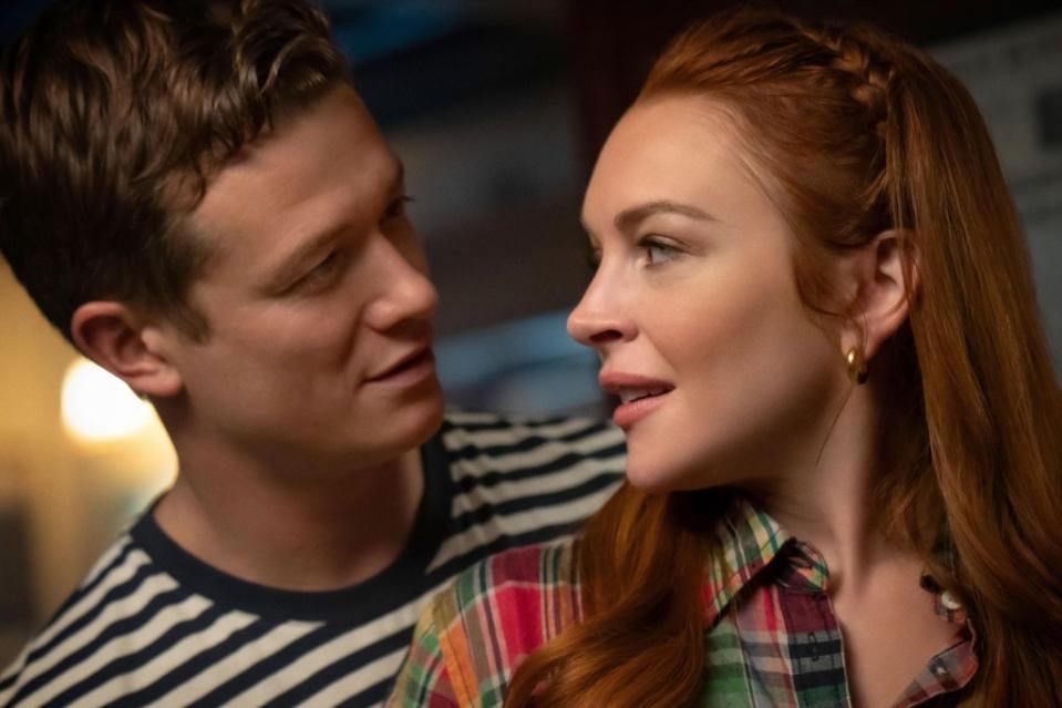 Even if Maddie (Lindsay Lohan) wished for Paul, fate intervenes when James (Ed Speleers) arrives. ©Netflix/Courtesy Everett Collection