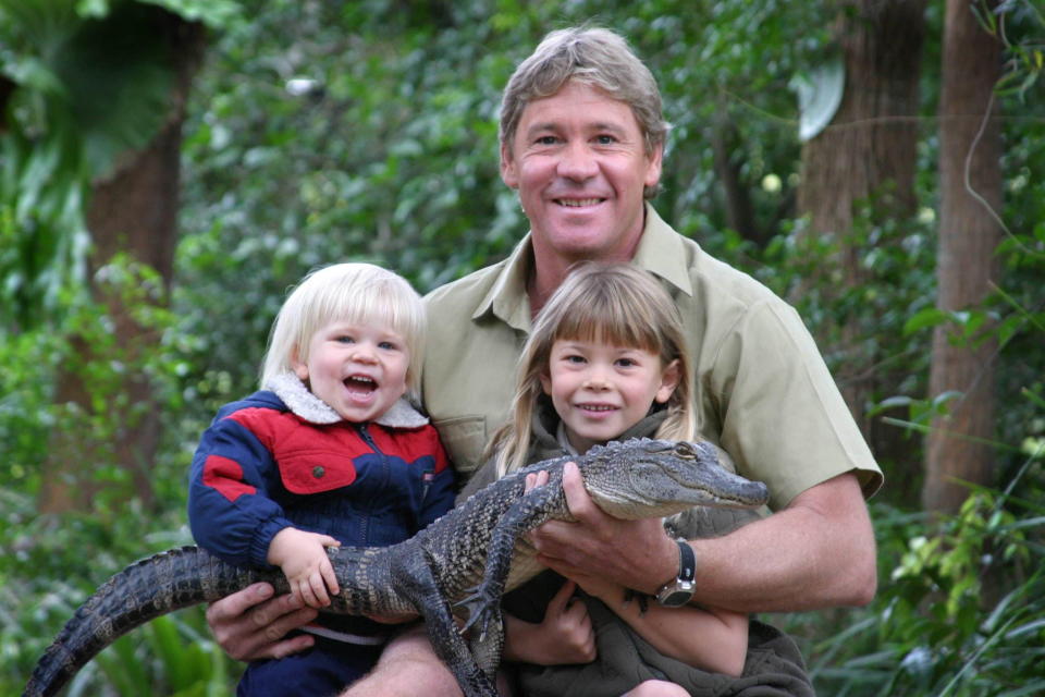 SUNSHINE COAST, AUSTRALIA - JUNE 25, 2005:  (EUROPE AND AUSTRALASIA OUT) 'Crocodile Hunter' Steve Irwin with his children, Bindi Irwin and Bob Irwin, and a 3-year-old alligator called 'Russ' at Australia Zoo in Queensland. (Photo by Newspix/Getty Images)