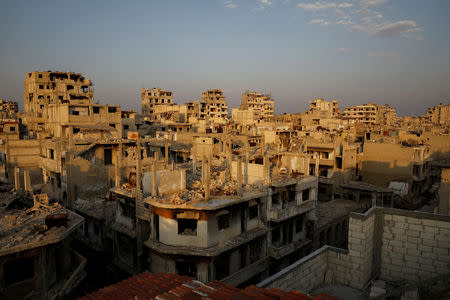 Destroyed buildings are seen in al-Khalidiya area in the government-controlled part of Homs, Syria, September 18, 2018. In the al-Khalidiya district of Homs, retaken by the government in 2013, after heavy army bombardment and air strikes, the slow nature of recovery is clear. Much of the neighbourhood is a ghost town, uninhabited and closed by the army. REUTERS/Marko Djurica