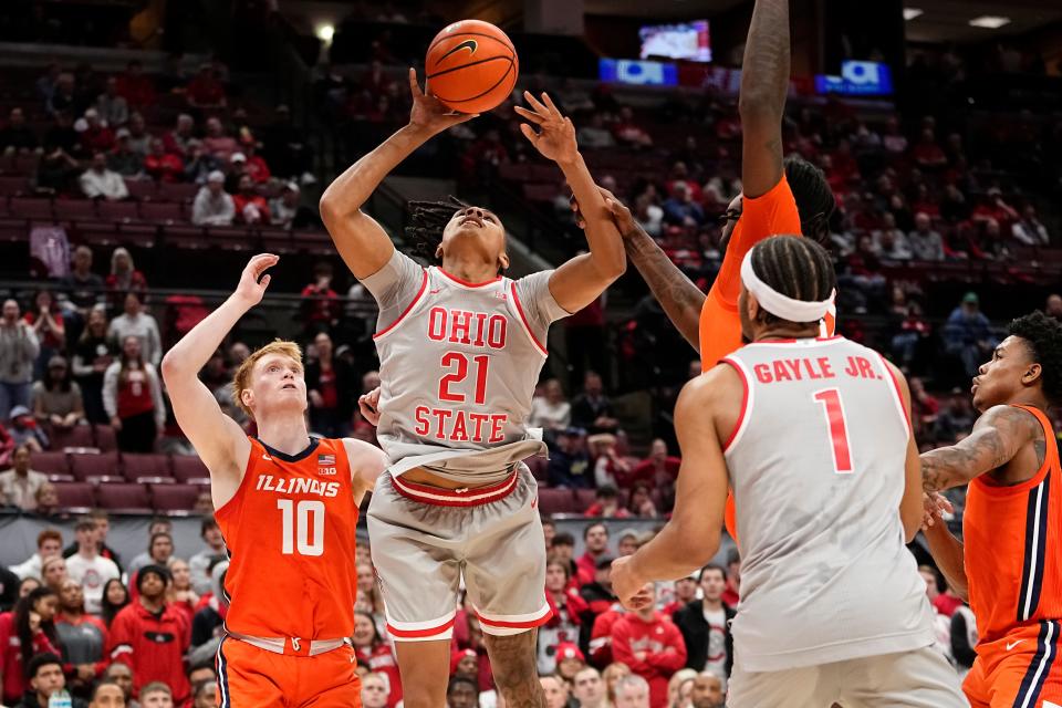 Feb 1, 2024; Columbus, Ohio, USA; Ohio State Buckeyes forward Devin Royal (21) shoots over Illinois Fighting Illini guard Luke Goode (10) during the second half of the NCAA men’s basketball game at Value City Arena. Ohio State lost 87-75.