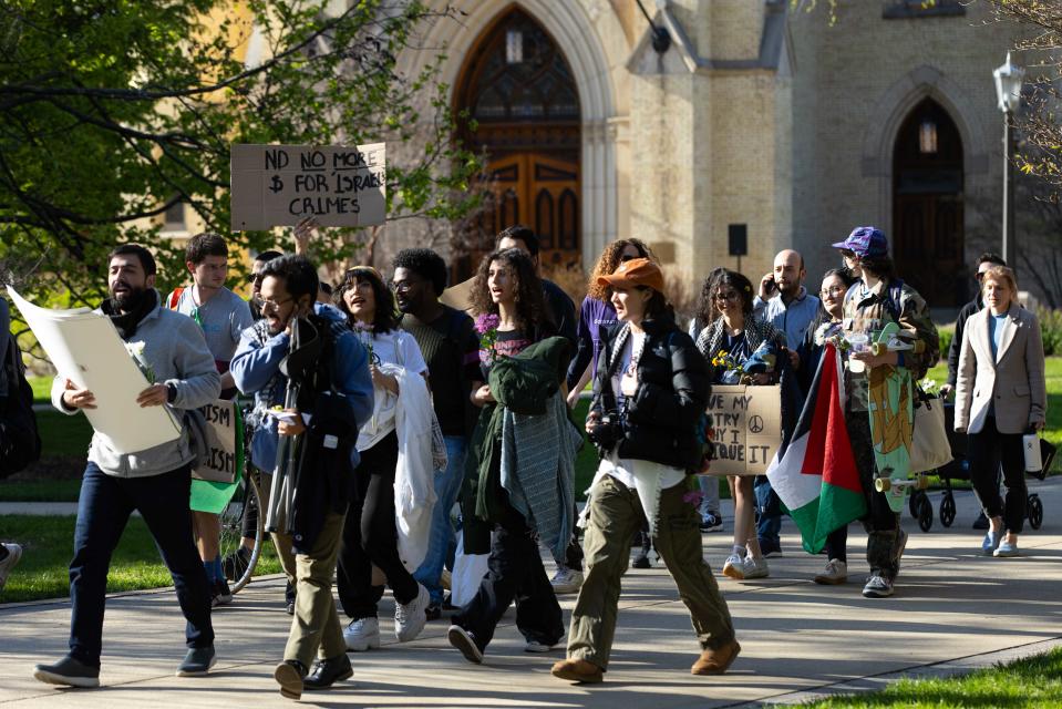 Students and community members march past Sacred Heart Basilica during a pro-Palestinian protest on the University of Notre Dame's campus on Thursday, April 25, 2024.