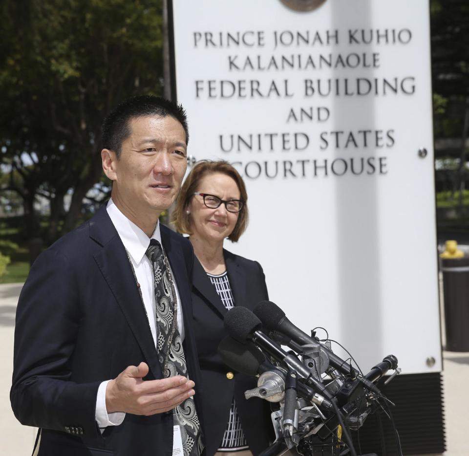 Hawaii Attorney General Douglas Chin, left, and Oregon Attorney General Ellen Rosenblum speak at a press conference outside the federal courthouse, Wednesday, March 15, 2107, in Honolulu. Hearings were scheduled Wednesday in Maryland, Washington state and Hawaii on President Donald Trump's travel ban. The lawsuit claims the ban harms Hawaii by highlighting the state's dependence on international travelers, its ethnic diversity and its welcoming reputation as the Aloha State. (AP Photo/Marco Garcia)