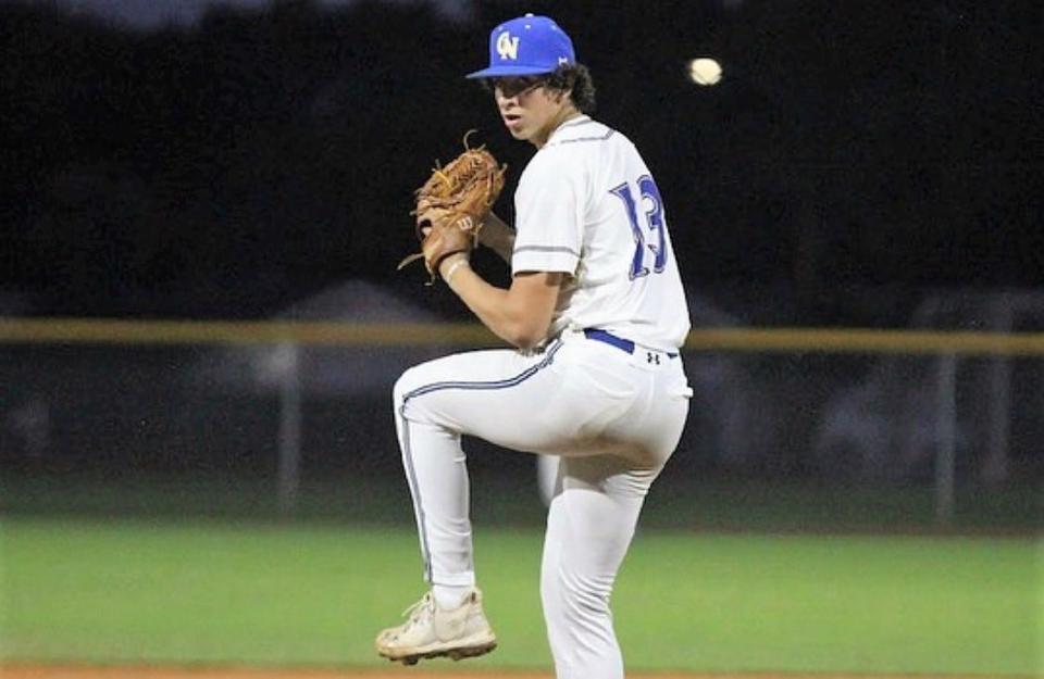 Cardinal Newman freshman Sam Lovitz prepares his next pitch for the Crusaders.