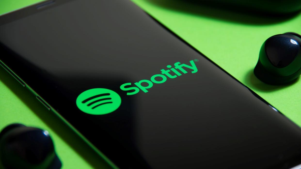  Spotify logo displayed on phone. 