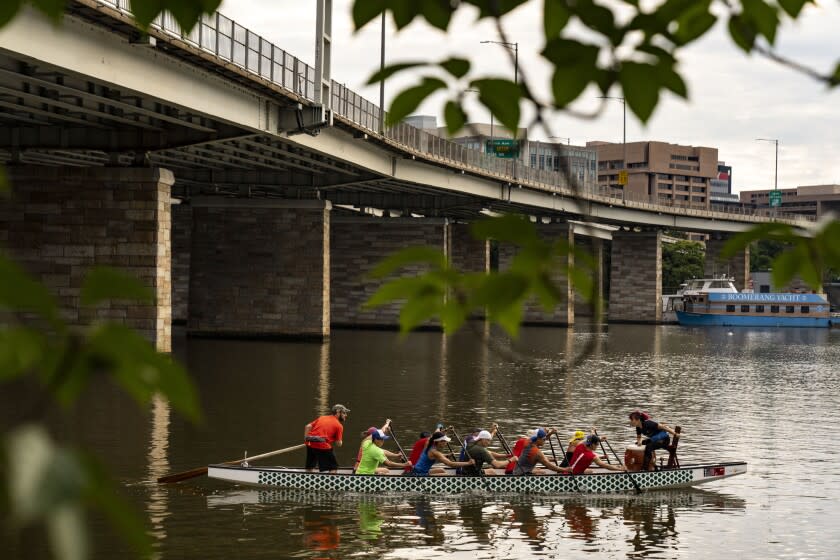 WASHINGTON, DC - JULY 10: The DC Dragon Boat Club practices in the Washington Channel near the DC Wharf on Sunday, July 10, 2022 in Washington, DC. (Kent Nishimura / Los Angeles Times)