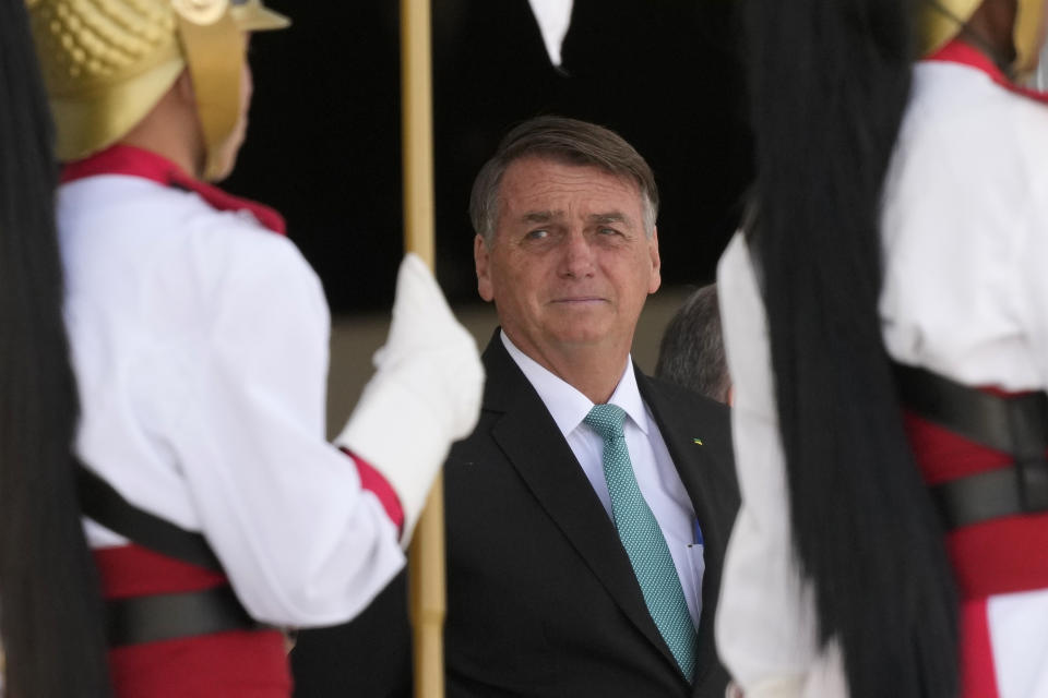 Brazilian President Jair Bolsonaro attends a welcomes ceremony for Hungary's President Katalin Novak at Planalto presidential palace in Brasilia, Brazil, Monday, July 11, 2022. (AP Photo/Eraldo Peres)