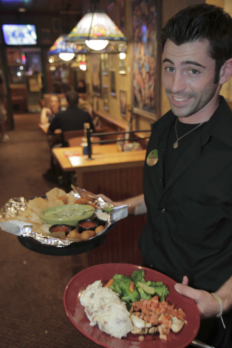 <p><a href="https://www.gettyimages.com/detail/news-photo/waiter-serving-food-in-applebees-neighborhood-grill-and-bar-news-photo/630060404" rel="nofollow noopener" target="_blank" data-ylk="slk:This Applebee's employee;elm:context_link;itc:0;sec:content-canvas" class="link ">This Applebee's employee</a> reports one of the most peevish things a host and/or server can deal with is someone who wants to switch seats after being seated, <em>especially </em>if an entree has already arrived. But that's a given, right? </p>