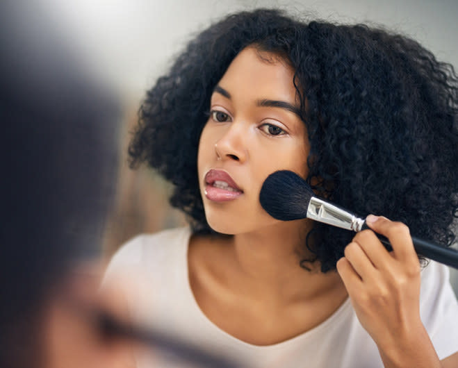 Person putting on makeup