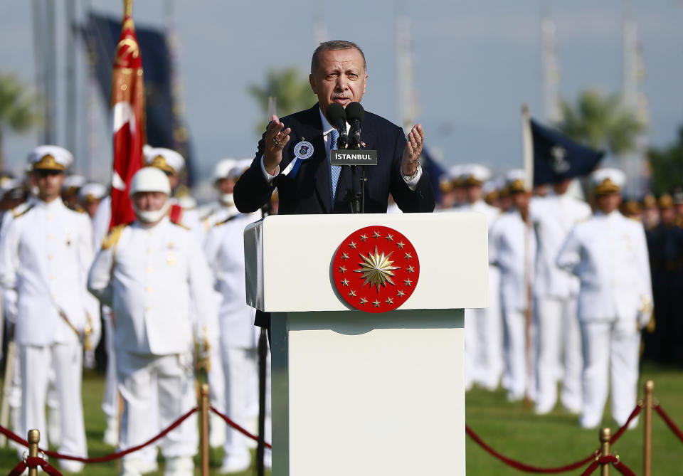 Turkey's President Recep Tayyip Erdogan delivers a speech to graduates of a military academy in Istanbul, Saturday, Aug. 31, 2019. Erdogan said the U.S. had up to three weeks to satisfy Turkish demands and has threatened to launch a unilateral offensive into northeastern Syria if plans to establish a so-called safe zone along Turkey's border fail to meet his expectations. Earlier this month, Turkish and U.S. officials agreed to set up the zone east of the Euphrates River. (Presidential Press Service via AP, Pool)