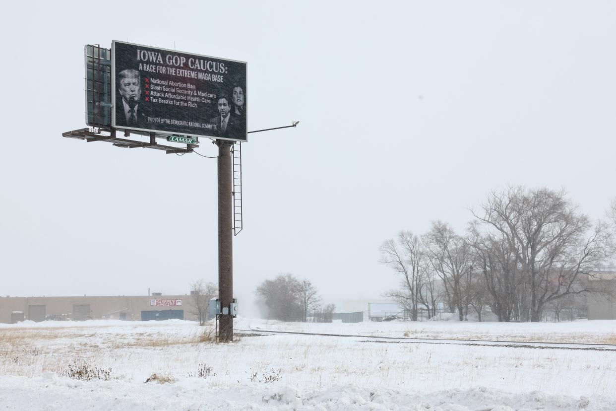 A digital billboard paid for by the Democratic National Committee critical of the Republican presidential candidates stands in blizzard conditions on Jan.13, 2024 in Council Bluffs, Iowa.