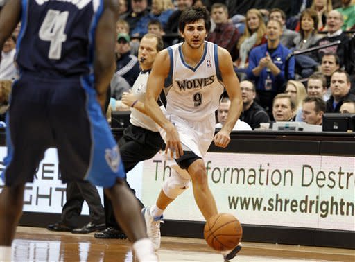 Minnesota Timberwolves point guard Ricky Rubio (9), of Spain, brings the ball upcourt on a steal against the Dallas Mavericks during the first half on an NBA basketball game on Saturday, Dec. 15, 2012, in Minneapolis. Rubio was making his season debut after recovering from surgery on his left knee. (AP Photo/Genevieve Ross)