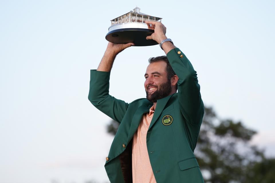 Scottie Scheffler holds the trophy after winning the Masters golf tournament at Augusta National Golf Club Sunday, April 14, 2024, in Augusta, Ga. (AP Photo/Matt Slocum)