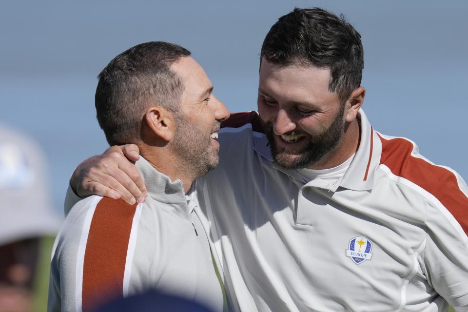 Team Europe's Sergio Garcia and Team Europe's Jon Rahm celebrate after winning their foursomes match the Ryder Cup at the Whistling Straits Golf Course Saturday, Sept. 25, 2021, in Sheboygan, Wis. (AP Photo/Ashley Landis)