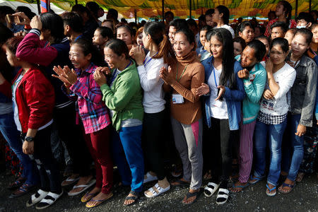 Garment workers welcome Cambodia's Prime Minister Hun Sen during a rally in Kandal province, Cambodia May 30, 2018. Picture taken May 30, 2018. REUTERS/Samrang Pring