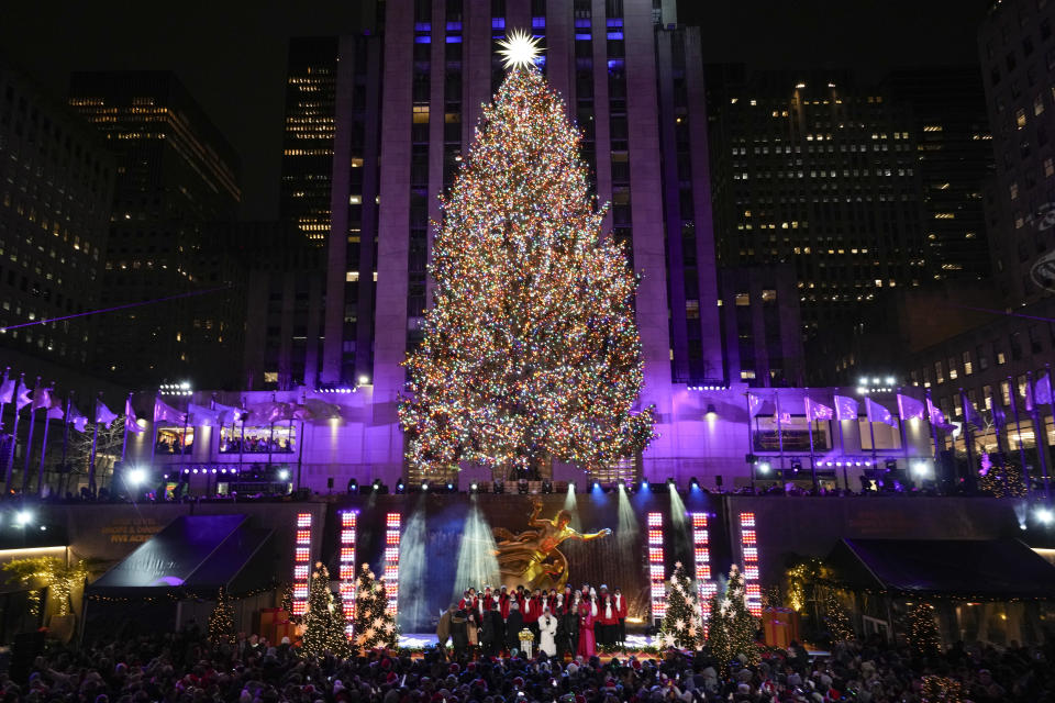 The Christmas tree at Rockefeller Center is lit in New York, Wednesday, Nov. 29, 2023. (AP Photo/Seth Wenig)