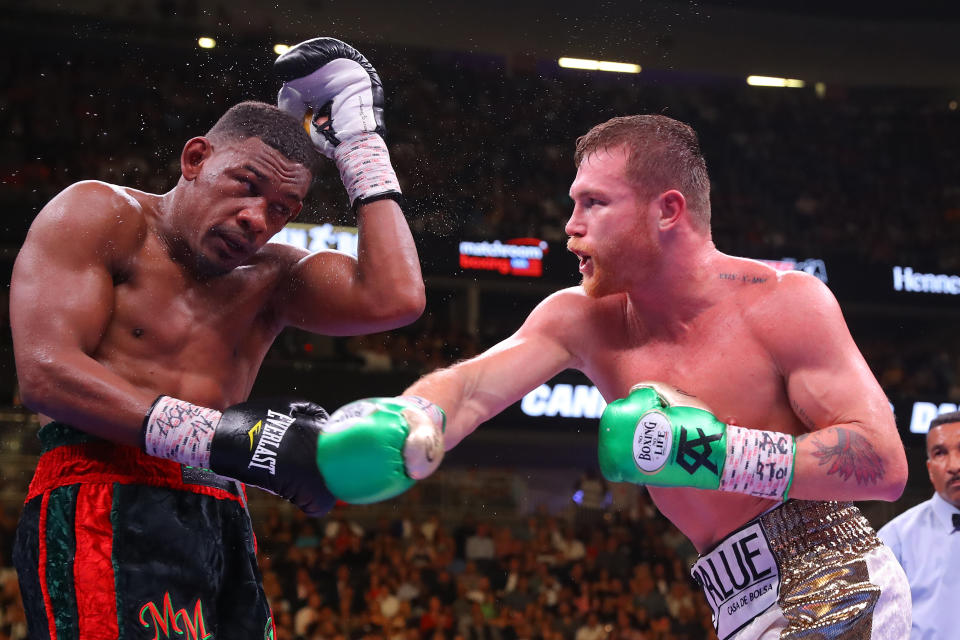 LAS VEGAS, NEVADA - MAY 04: Canelo Alvarez (R) punches Daniel Jacobs during their middleweight unification fight at T-Mobile Arena on May 04, 2019 in Las Vegas, Nevada. (Photo by Tom Hogan/Golden Boy/Golden Boy/Getty Images)