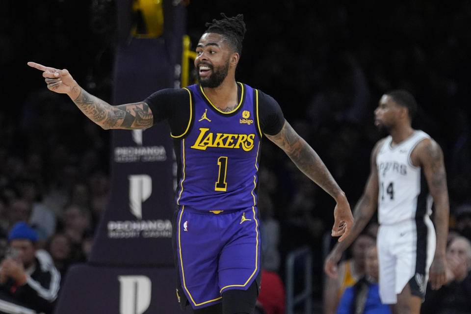 Los Angeles Lakers guard D'Angelo Russell (1) reacts after scoring during the first half of the team's NBA basketball game against the San Antonio Spurs, Friday, Feb. 23, 2024, in Los Angeles. (AP Photo/Marcio Jose Sanchez)