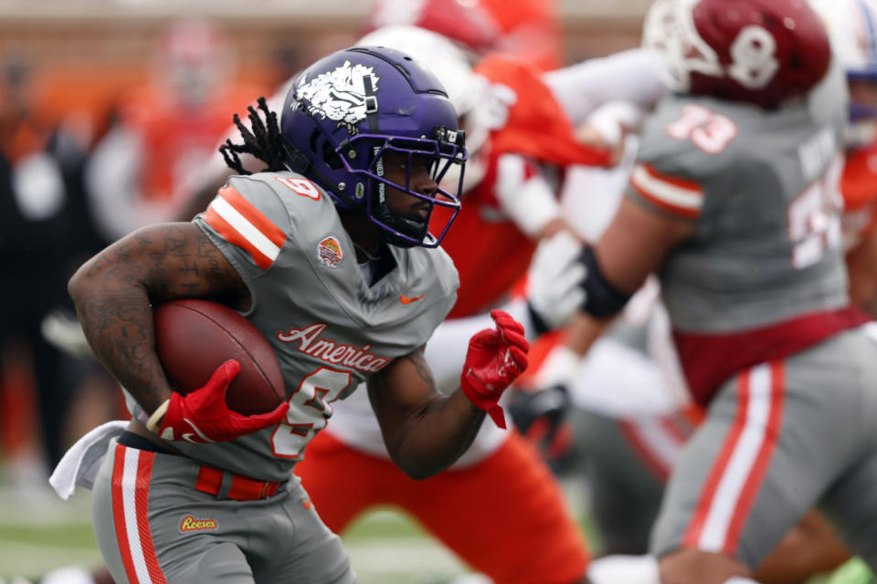 American running back Emani Bailey of TCU carries the ball against the National team during the first half of the Senior Bowl NCAA college football game, Saturday, Feb. 3, 2024, in Mobile, Ala. (AP Photo/ Butch Dill)