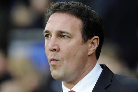 Malky Mackay is seen before their English Premier League soccer match against Southampton at Cardiff City Stadium in Cardiff, Wales, December 26, 2013. REUTERS/Rebecca Naden