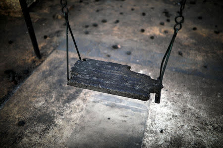 A burnt seesaw is seen in a playground following a wildfire at the village of Mati, near Athens, Greece, July 25, 2018. REUTERS/Alkis Konstantinidis