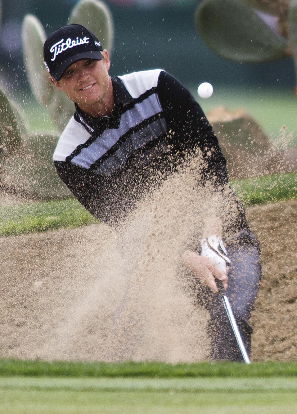 Matt Jones hits from bunker on the 12th hole during second round action at the Waste Management Phoenix Open at the TPC Scottsdale, Friday, Jan. 31, 2014. (AP Photo/The Arizona Republic, Tom Tingle) MARICOPA COUNTY OUT; MAGS OUT; NO SALES